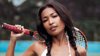 Beautiful ebony tennis player strips and poses on the court